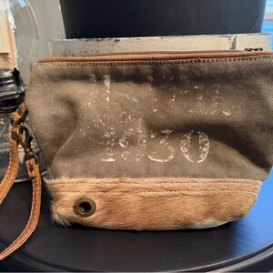 Lnwot Myra Bag Beige Canvas Wristlet with Tan leather trim and faux fur bottom.